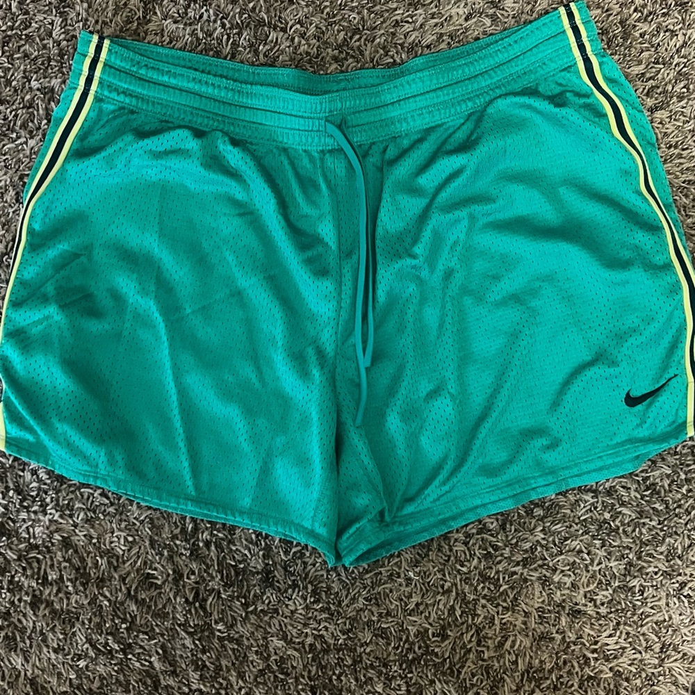Nike Teal Women's Athletic Shorts with Yellow Stripes